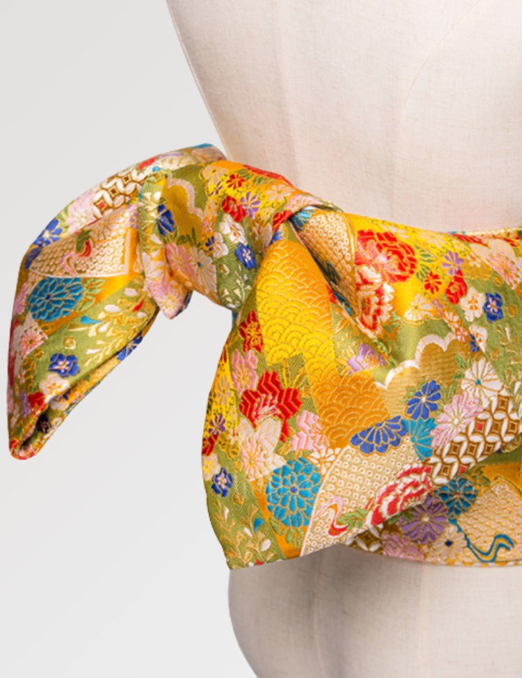 Beautiful yellow kimono obi belt for women in a traditional Japanese pattern