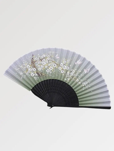 Beautiful black fan in Japanese style with sakura pattern