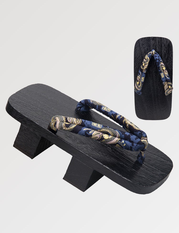 The Japanese wooden geta with a traditional pattern tinted in a deep black