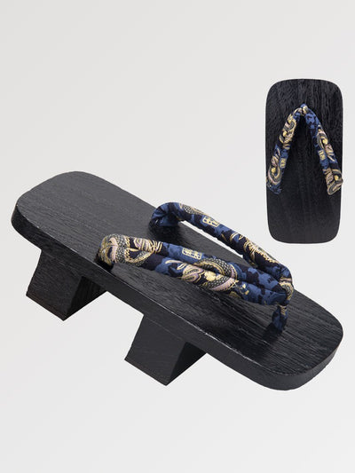 The Japanese wooden geta with a traditional pattern tinted in a deep black
