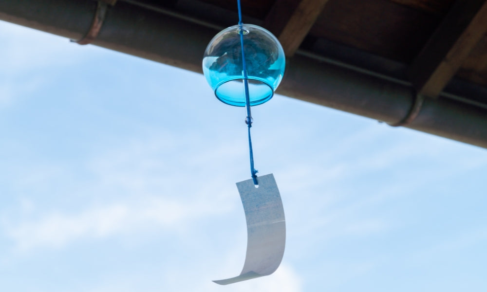 Japanese furin wind chimes at a summer festival - traditional Japanese wind bells with colorful tanzaku paper strips