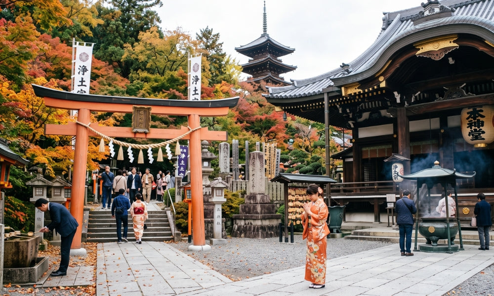 A Japanese shrine and Buddhist temple complex in autumn with a vermilion torii gate, five-story pagoda, incense burner and a worshipper in kimono praying