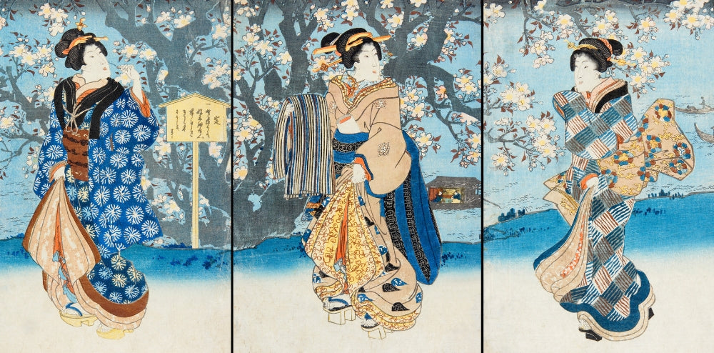 Ukiyo-e woodblock print triptych of three women in kimono (bijin-ga) beneath cherry blossoms by the water, in classic Japanese floating-world style