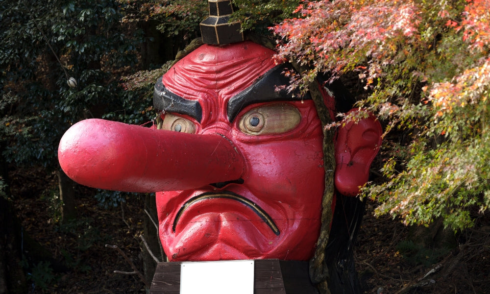 Tengu yokai - long-nosed red Japanese demon statue, one of the most famous Japanese mythical creatures and folklore demons