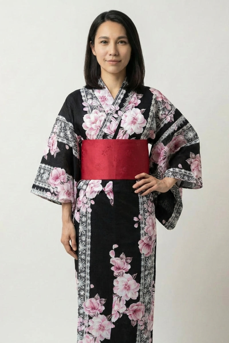 Black Japanese kimono for women with pink and white cherry blossom print and red obi belt