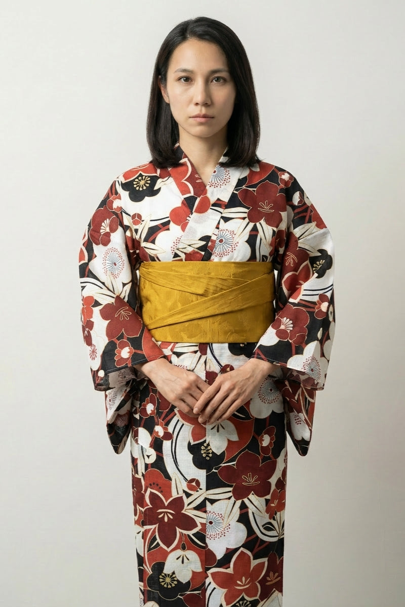 Antique Japanese kimono with red and white plum blossom print and mustard yellow obi belt