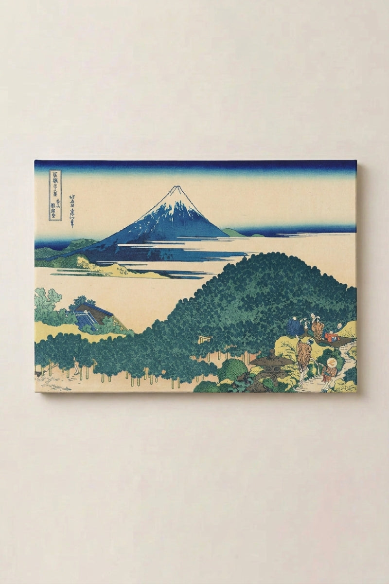 Japanese Mountain Print 'Akigo' — Japanese ukiyo-e-style print depicting a blue Mount Fuji rising above a forested hill at dawn, ukiyo-e canvas print, shown on a wall