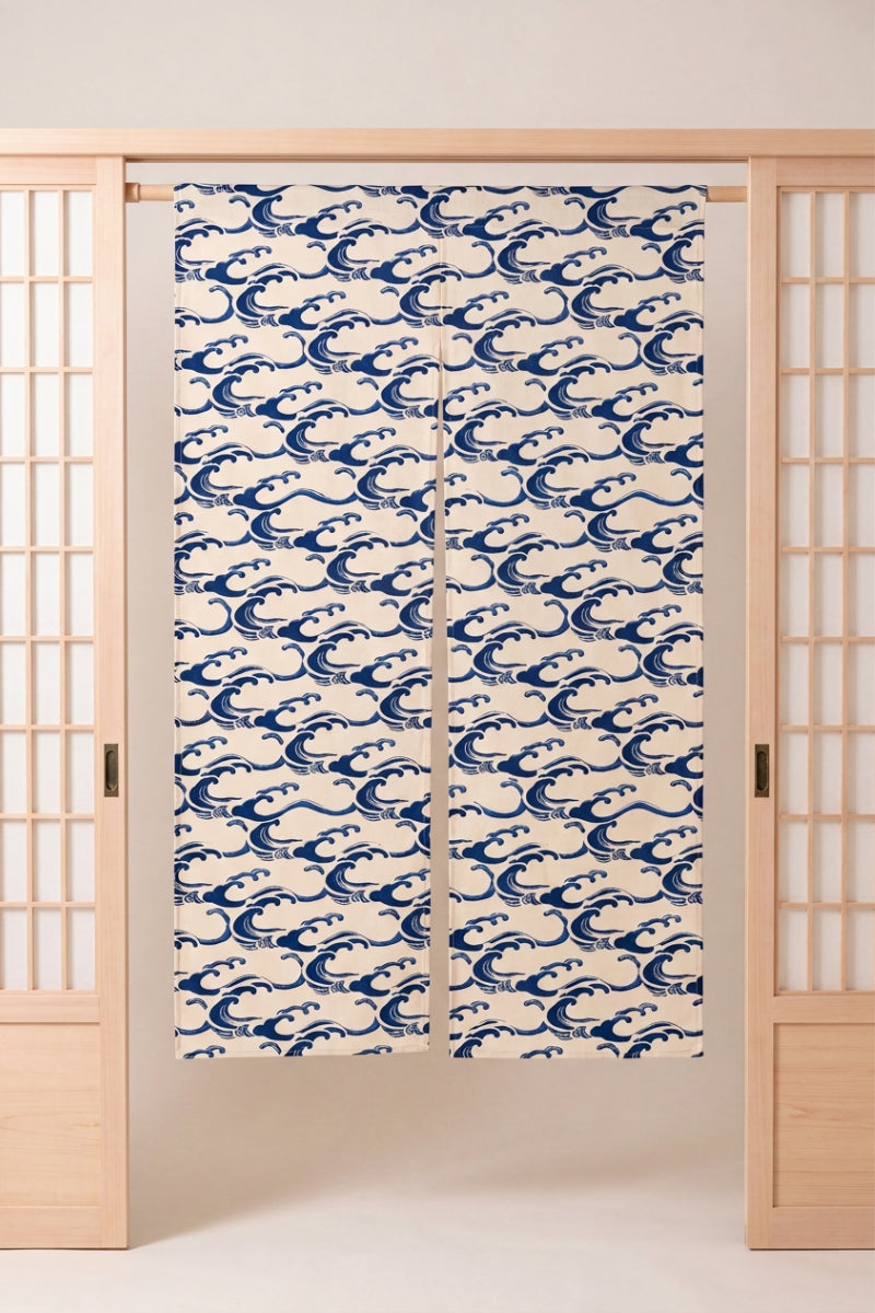 Japanese Noren 'Umikaze' — split doorway curtain printed with small stylized indigo breaking waves on a cream ground, traditional Japanese room divider
