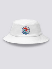 Grey bucket hat with an embroidered navy medallion of a red torii half-submerged in foaming waves under a red sun