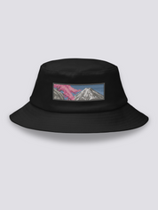 Black bucket hat with an embroidered sumi-e patch of Mount Fuji in white and grey with a cherry branch over a slate sky