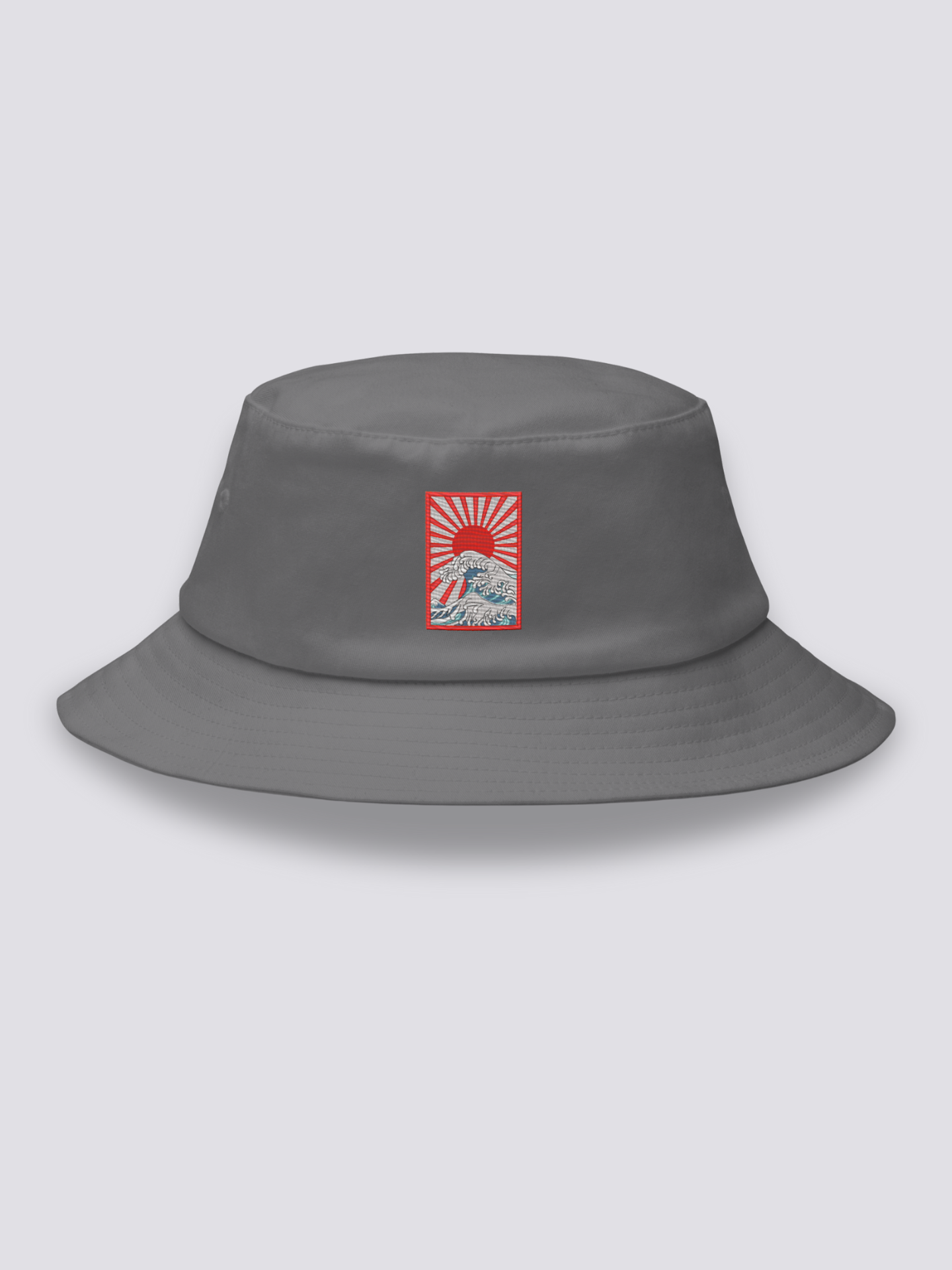 Grey bucket hat with an embroidered rectangular patch of a rayed sun above Hokusai-style waves