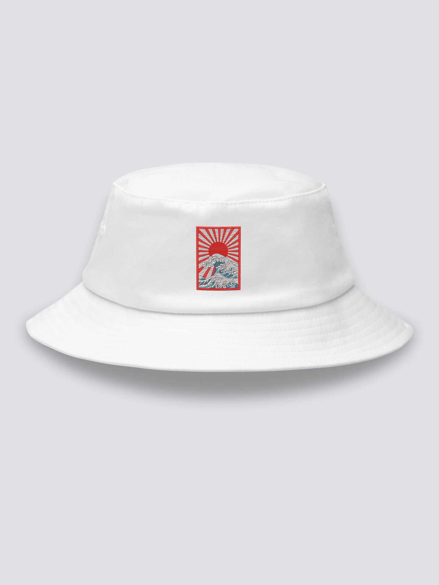 White bucket hat with an embroidered rectangular patch of a rayed sun above Hokusai-style waves
