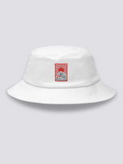 White bucket hat with an embroidered rectangular patch of a rayed sun above Hokusai-style waves