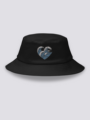Black bucket hat with three embroidered ukiyo-e waves arranged into a heart shape in blue and white
