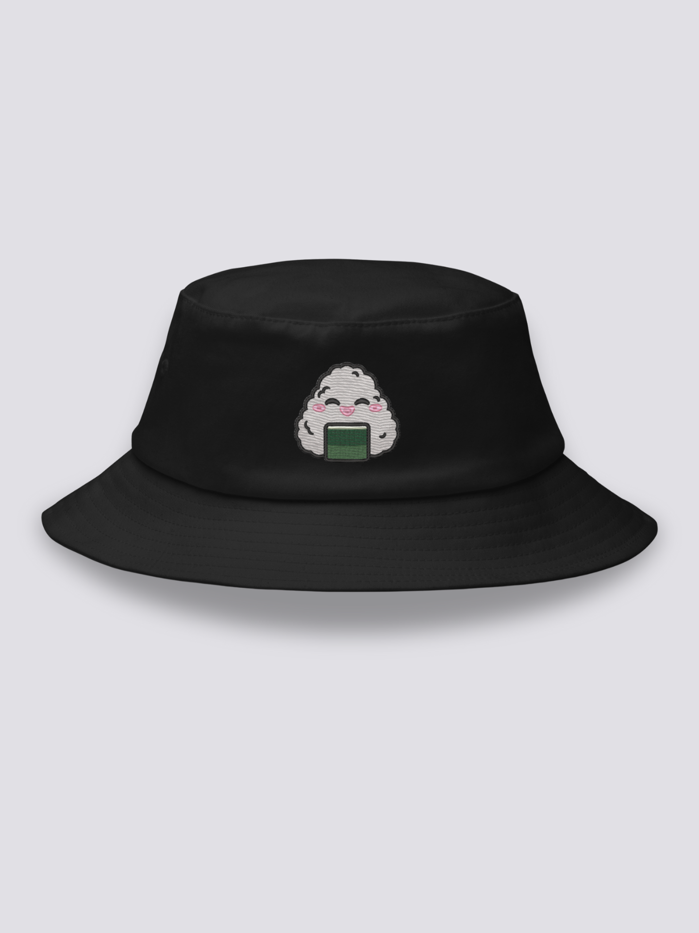 Black bucket hat with an embroidered smiling kawaii onigiri rice ball with closed eyes, pink cheeks and a band of nori