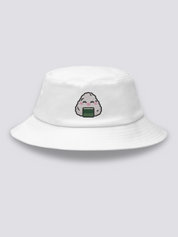 Khaki bucket hat with an embroidered smiling kawaii onigiri rice ball with closed eyes, pink cheeks and a band of nori