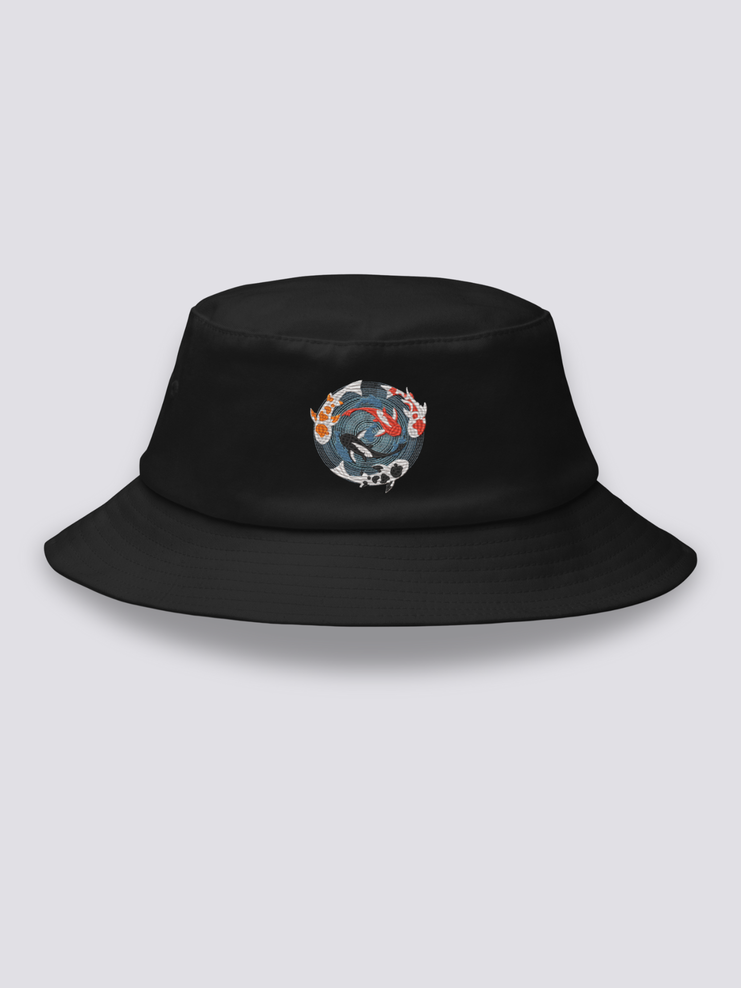 Black bucket hat with an embroidered overhead medallion of koi carp circling a whirlpool around a white lotus