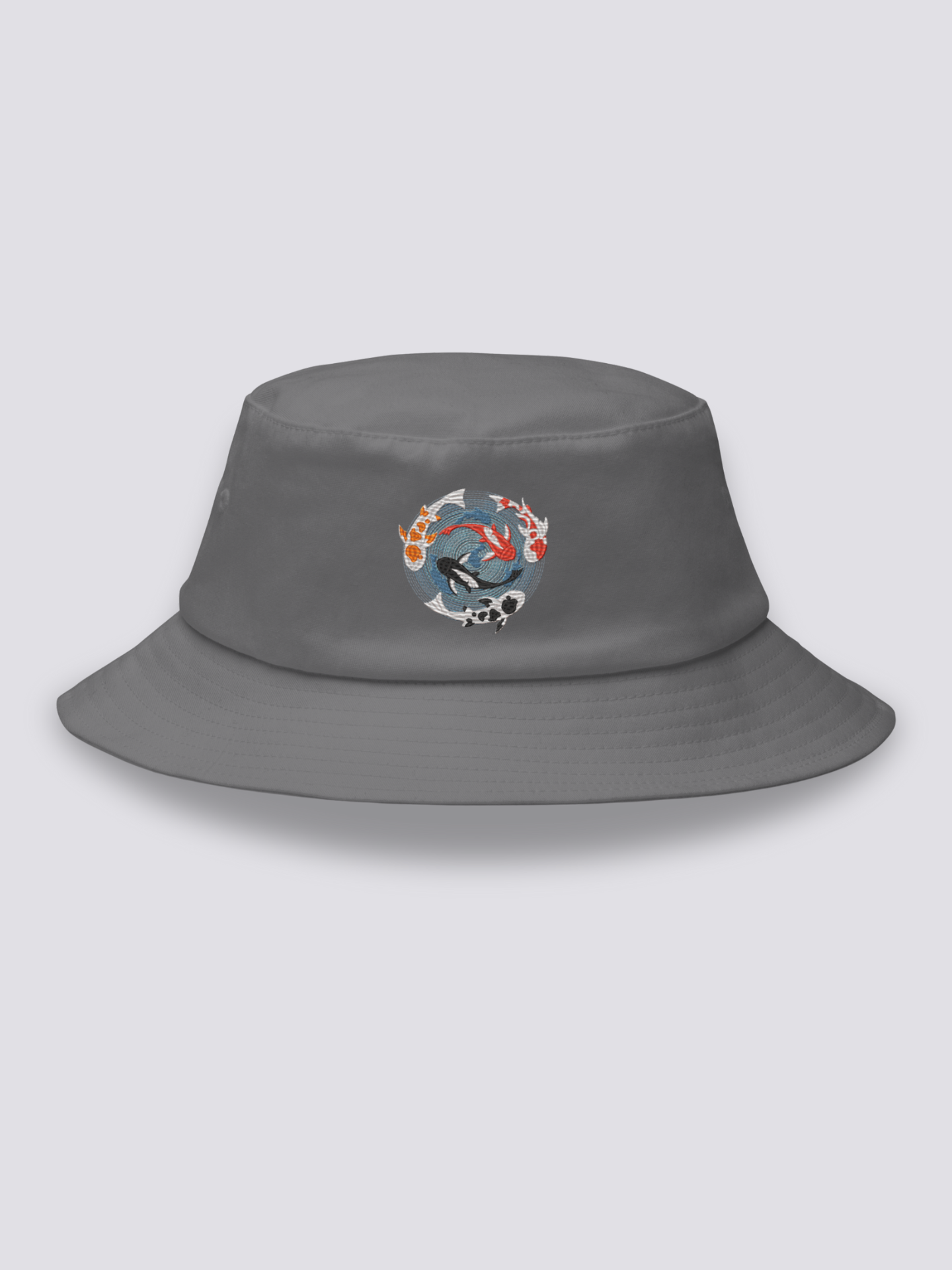 Grey bucket hat with an embroidered overhead medallion of koi carp circling a whirlpool around a white lotus