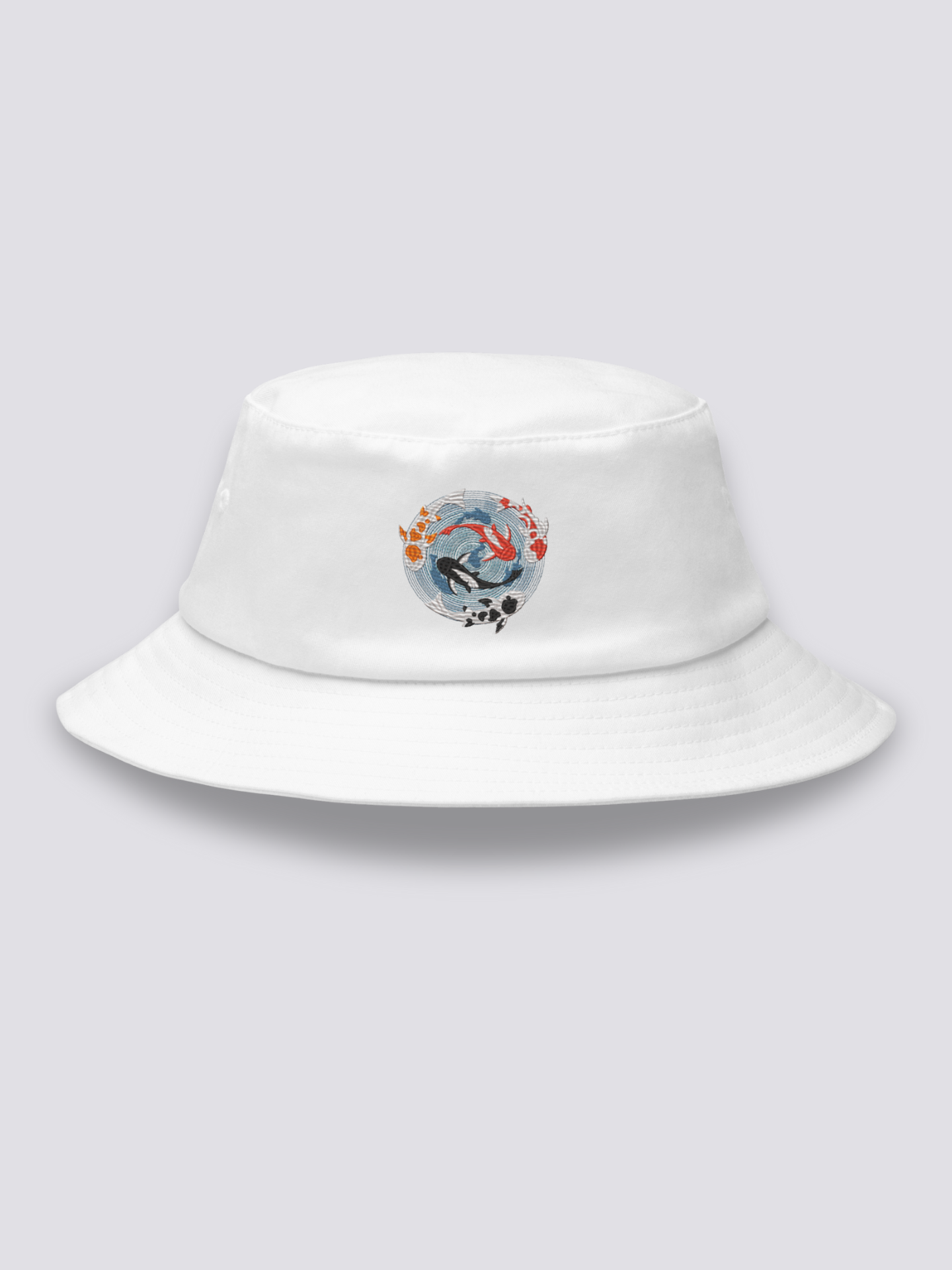 White bucket hat with an embroidered overhead medallion of koi carp circling a whirlpool around a white lotus
