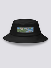 Black bucket hat with an embroidered patch of two red and white koi carp among lily pads and a white lotus