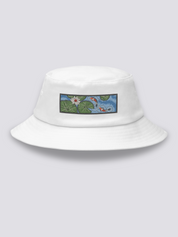 Khaki bucket hat with an embroidered patch of two red and white koi carp among lily pads and a white lotus