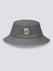 White bucket hat with an embroidered smiling maneki neko beckoning cat holding a gold koban coin
