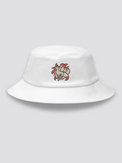 White bucket hat with an embroidered cream nine-tailed kitsune fox with red eyes and tails fanned in orange and white
