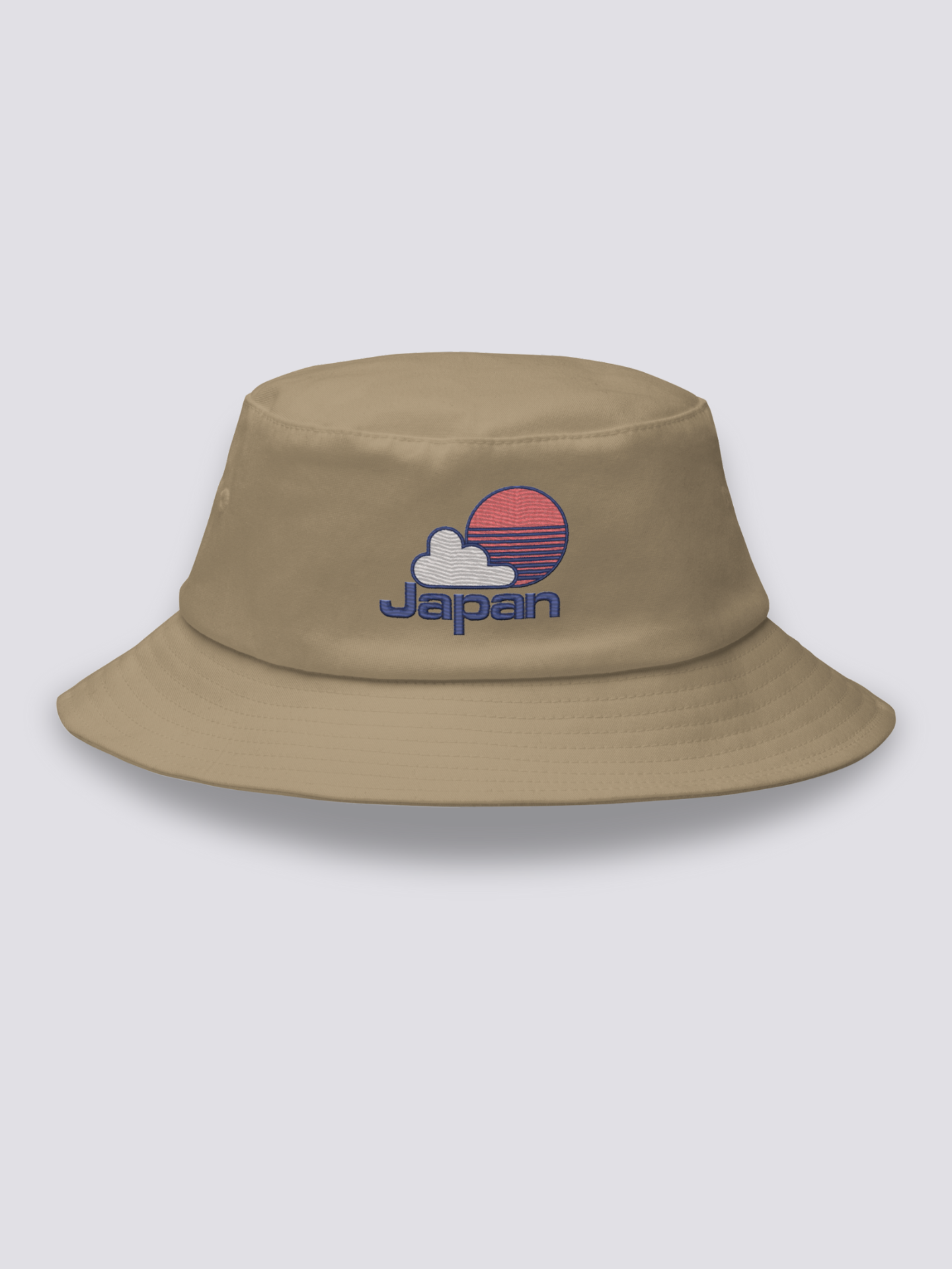 Grey bucket hat with an embroidered red striped sun behind a white cloud above JAPAN in navy lettering