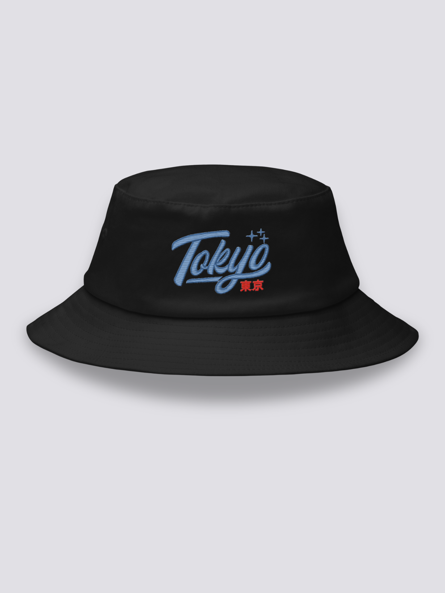 Black bucket hat with Tokyo embroidered in thick blue vintage cursive script above the red kanji 東京