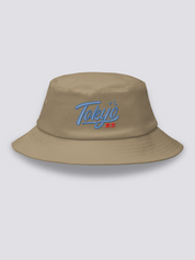 Khaki bucket hat with Tokyo embroidered in thick blue vintage cursive script above the red kanji 東京