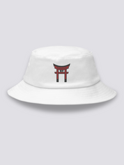 Khaki bucket hat with a single vermilion torii gate embroidered in a minimal architectural study