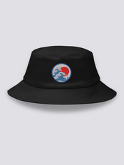 Black bucket hat with an embroidered blue medallion of the Great Wave breaking beneath a full red sun