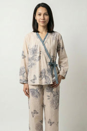 Beige double gauze Japanese pajama set for women with butterfly and peony ink print and slate blue V-collar trim