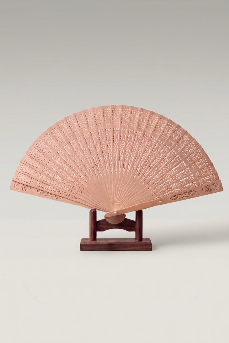 Japanese folding fan 'Chikuzai' — plain carved pale bamboo slats forming a natural sensu folding fan, shown open on a wooden stand