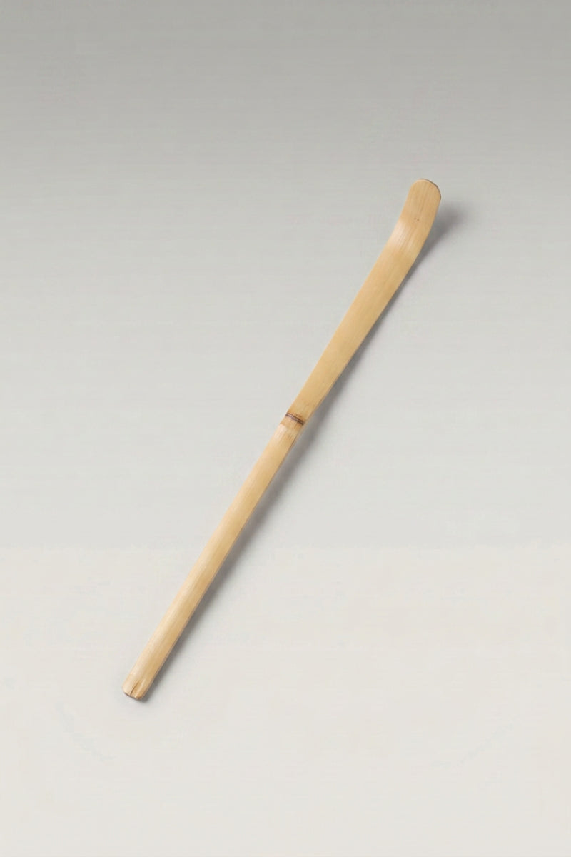 Chashaku bamboo matcha scoop in pale beige bamboo, hand-cut with a curved tip and a visible node