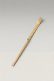 Chashaku bamboo matcha scoop in pale beige bamboo, hand-cut with a curved tip and a visible node