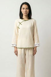 Cream double gauze Japanese pajama set for women with round neck, sage trim, knot closure and seigaiha wave motif