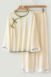 Cream double gauze Japanese pajama set for women, side view with sage trim and seigaiha wave motif