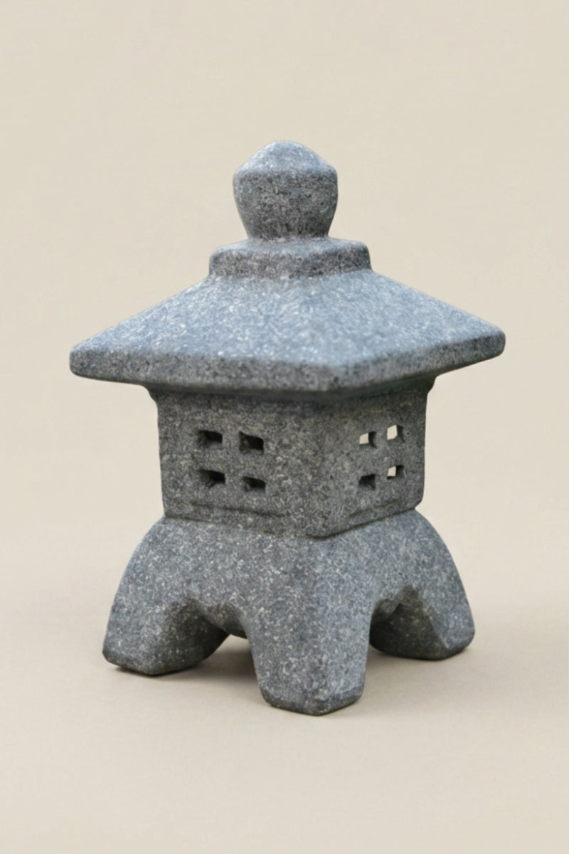 Decorative Japanese garden lantern — Japanese stone garden lantern, a grey stone garden lantern with a pagoda roof and four splayed legs