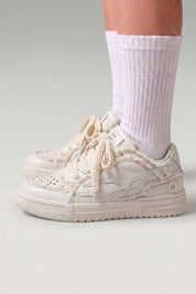 White premium Japanese sneakers 'Seiryu', worn on foot with white socks — Japanese streetwear style