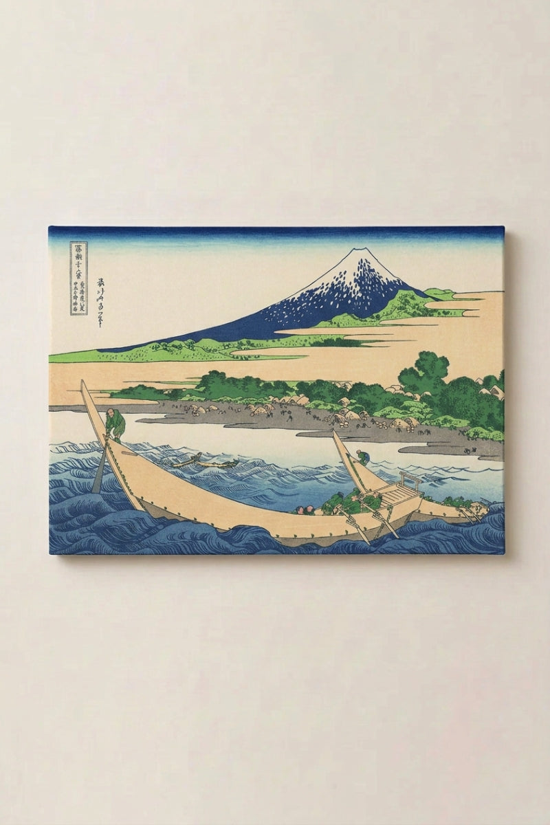 Japanese Print Artist 'Fuji View' — Japanese ukiyo-e-style print depicting a lone fishing boat below a green hill and blue Mount Fuji, ukiyo-e canvas print, shown on a wall