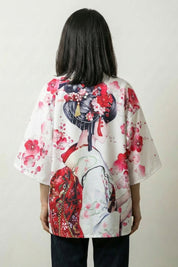 Back view of the white Sakura x Geiko kimono jacket, the geisha figure and pink blossom on a light ground