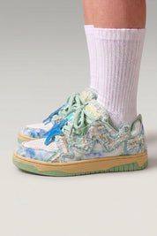Green Japanese designer sneakers 'Kasumi', worn on foot with white socks — Japanese streetwear style