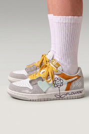 White Japanese streetwear sneakers 'Hanabi', worn on foot with white socks — Japanese streetwear style