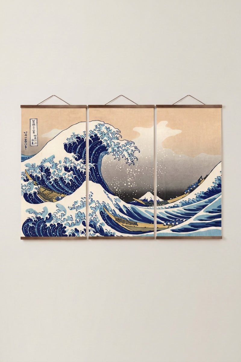 Japanese painting Wave 'Kanagawa' — Japanese ukiyo-e-style print depicting the great cresting wave of Kanagawa with Mount Fuji beyond, as a three-panel hanging wall art, shown on a wall