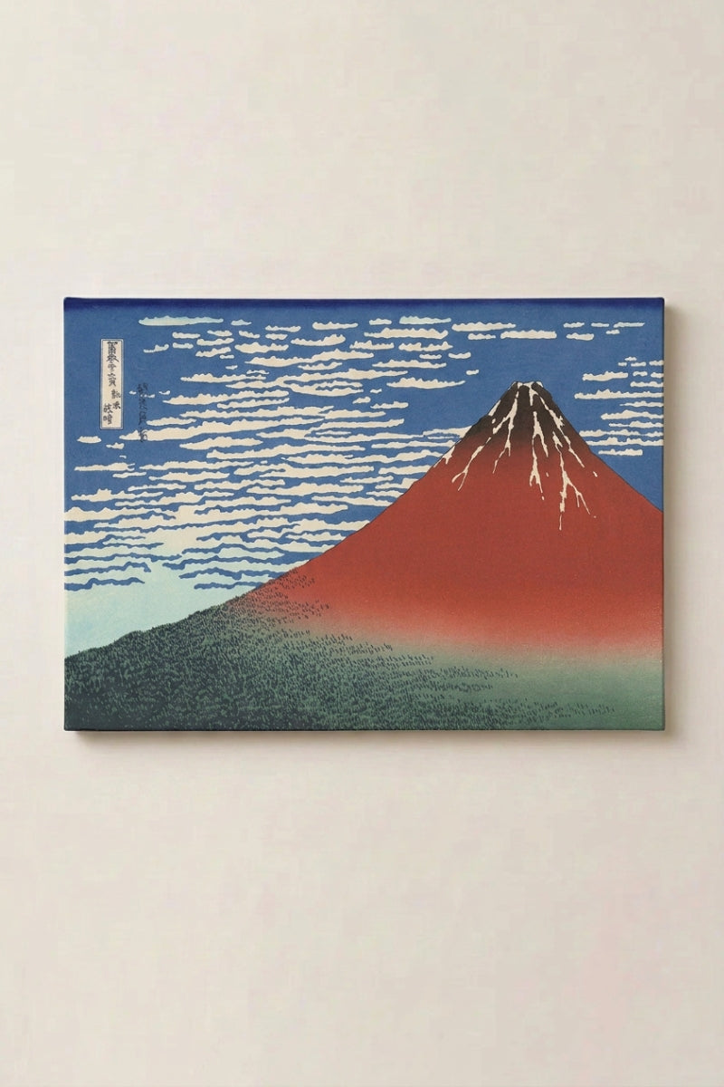 Japanese Hokusai print 'Okoshita' — Japanese ukiyo-e-style print depicting a red Mount Fuji beneath a mackerel sky, the Fine Wind Clear Morning scene, as canvas wall art, shown on a wall