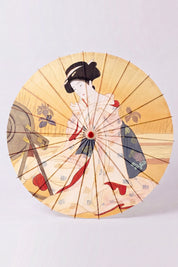 Traditional Japanese paper umbrella with a woman in a pale kimono with red accents on a glowing ochre-gold ground, shown open on bamboo ribs