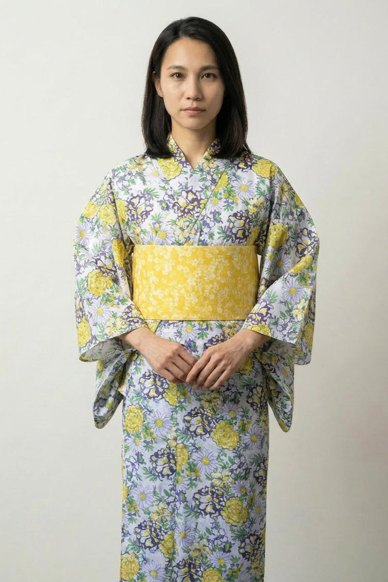 Lavender Japanese kimono with yellow and gold floral print and yellow obi belt