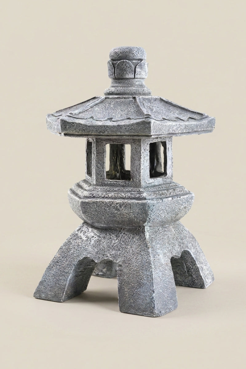 Japanese outdoor lantern — Japanese stone garden lantern, a grey stone garden lantern with a hexagonal roof and four arched legs