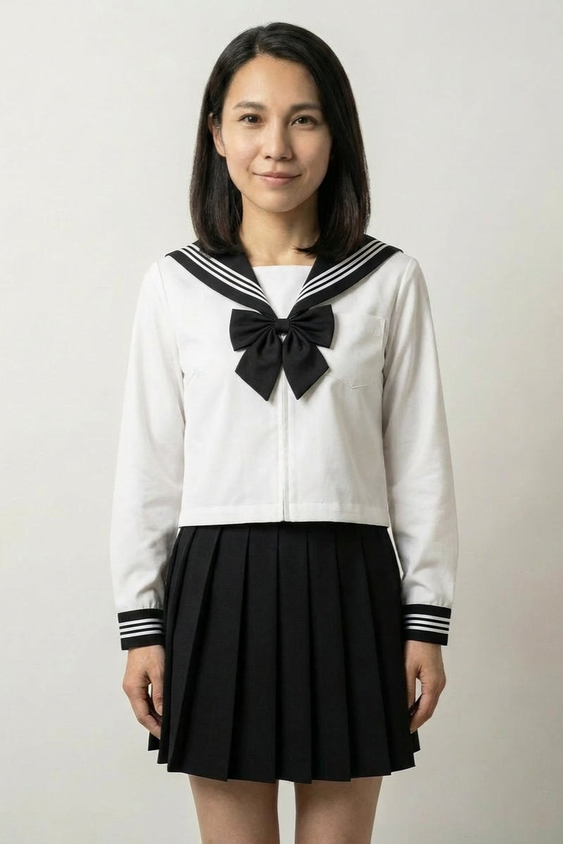 Japanese school uniform Academy Sailor: white sailor top with navy-trimmed collar, flat black ribbon bow and a black pleated skirt